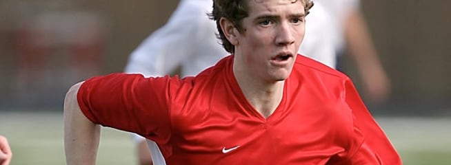 a picture of running soccer man