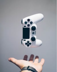 Hand holding a gaming controller